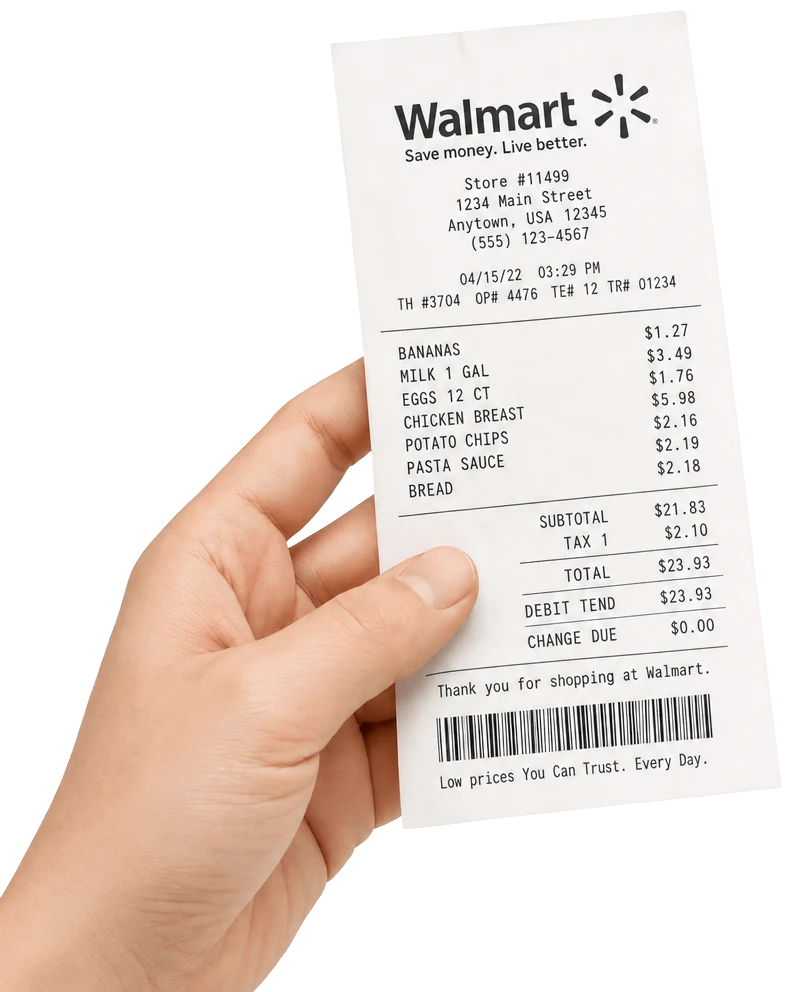A hand holding a Walmart receipt with bananas, milk, eggs, chicken breast and more